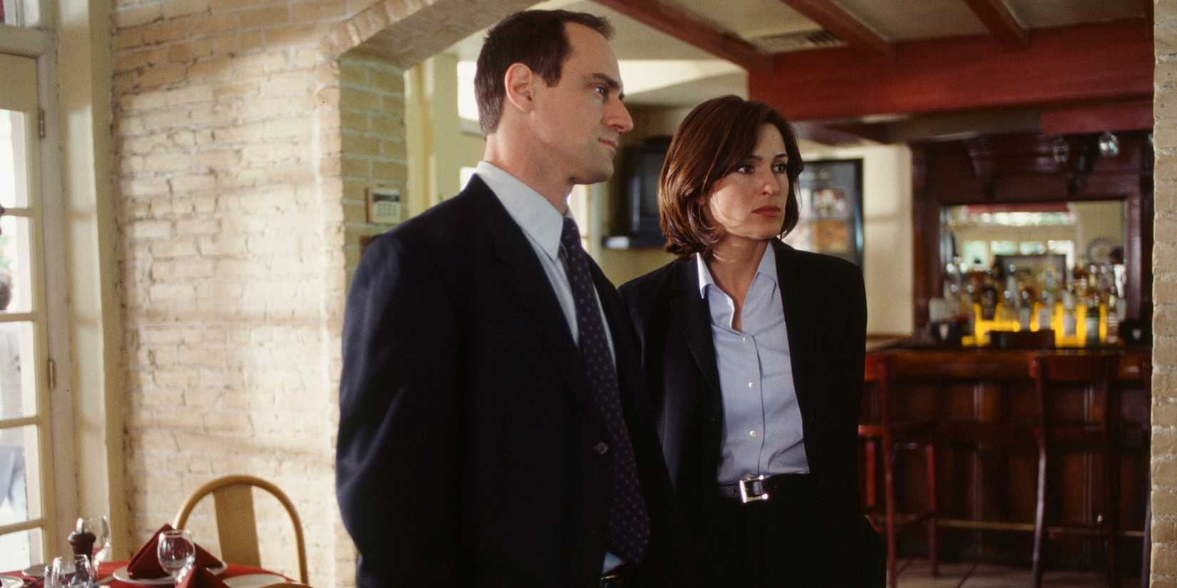 Stabler (Christopher Meloni) and Benson (Mariska Hargitay) stand in an empty restaurant in the Law & Order: SVU episode "Payback"
