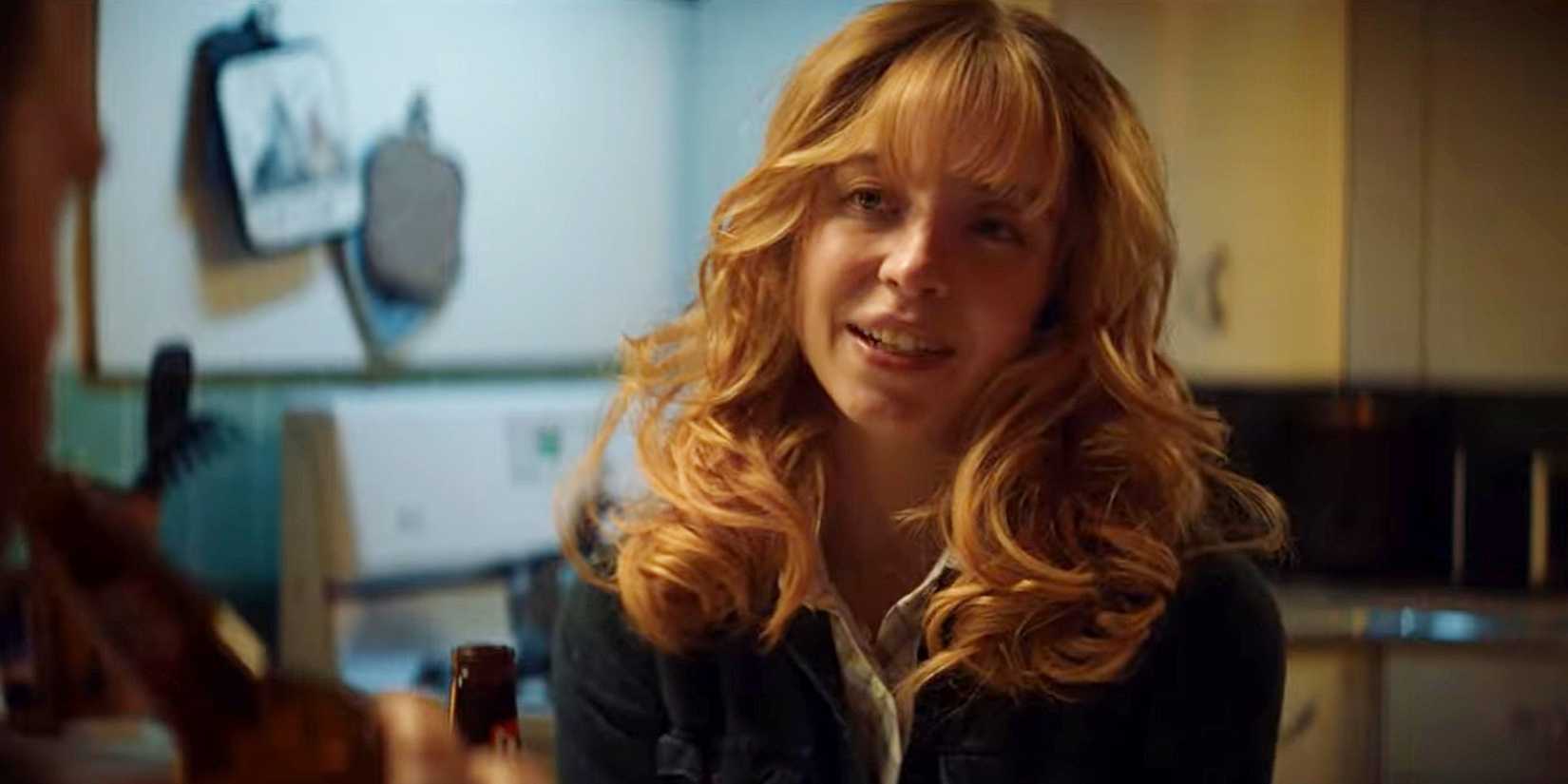 Sydney Sweeney with her head тιтled to the side as she looks at someone in Americana
