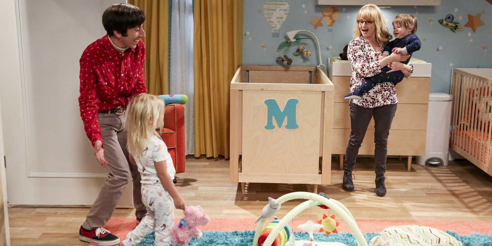 Howard (Simon Helberg) and Bernadette (Melissa Rauch) with their kids in the nursery in The Big Bang Theory