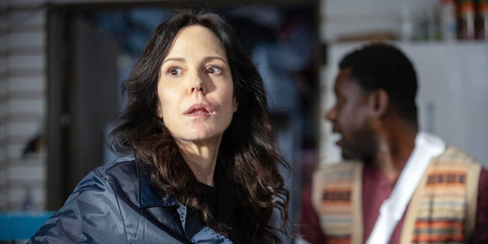 Ms. Sigsby (Mary-Louise Parker) looking around in The Institute
