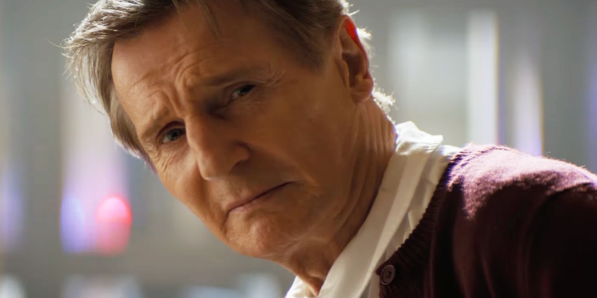 Liam Neeson looking serious in The Naked Gun.