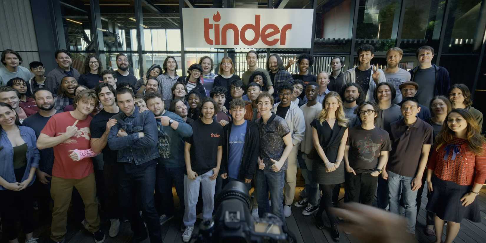 The staff of Tinder pose for a pH๏τo in the trailer for Swiped