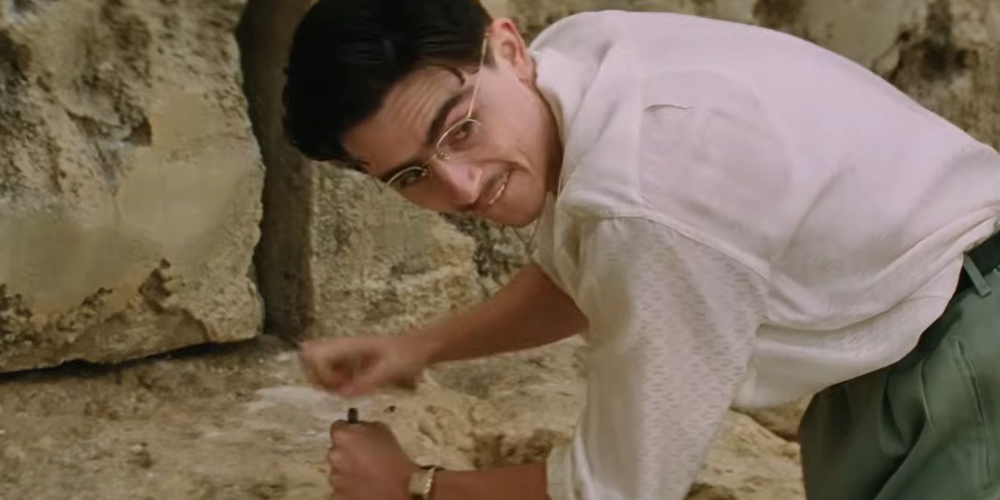 Timothee Chalamet as Marty Mauser hammering a nail in Marty Supreme
