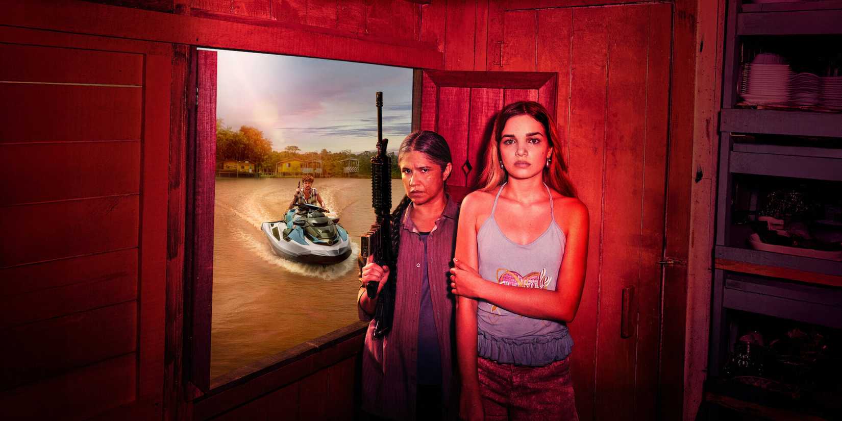 Two women stand in a room while one holds a gun in Rivers of Fate(1)