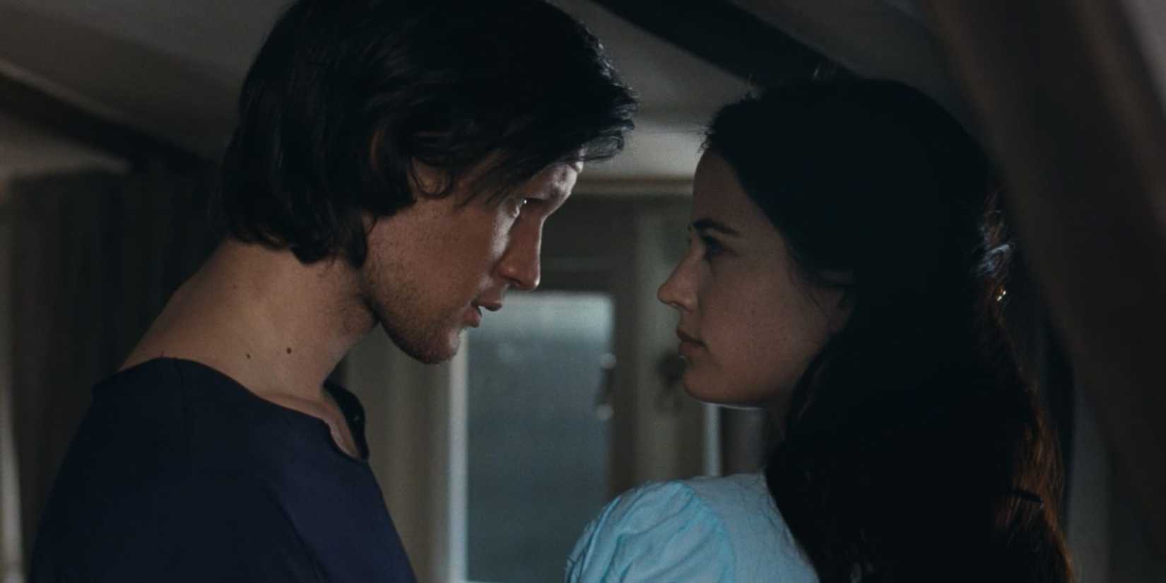 Eva Green as Rebecca and Matt Smith as Tommy staring at each other intensely in Womb.