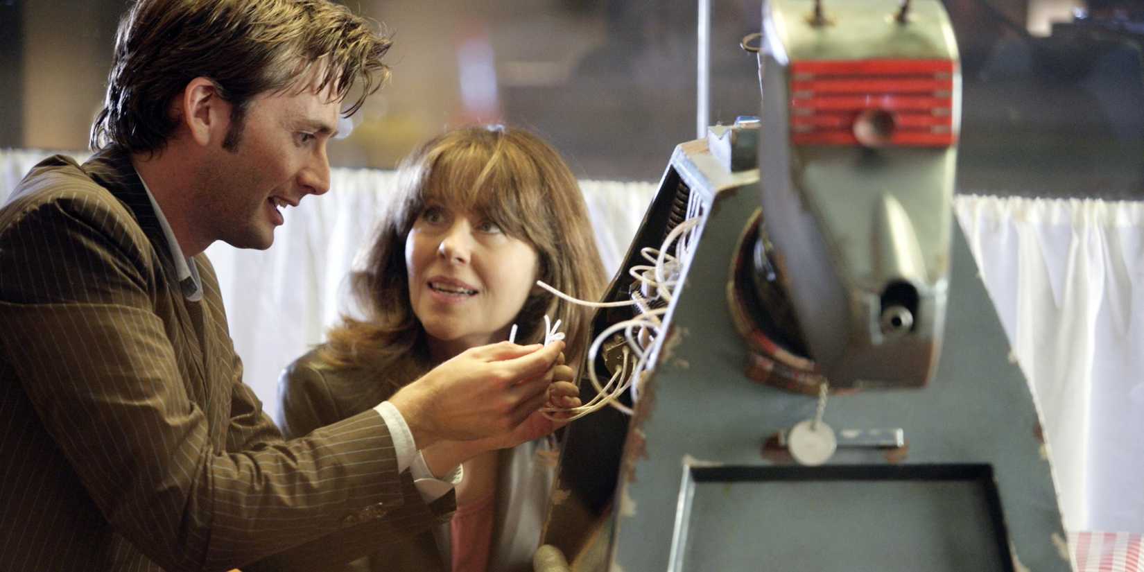 Sarah Jane watching the Tenth Doctor fixing K-9 as they sit in a café in the Doctor Who episode "School Reunion."
