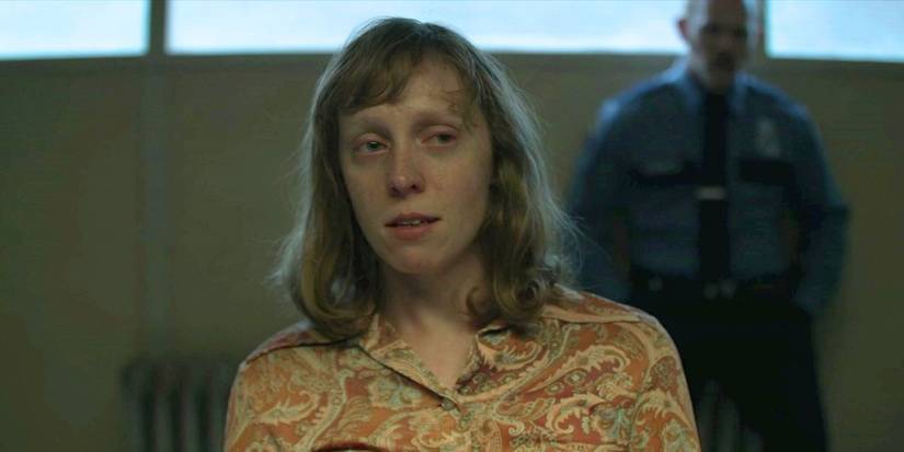 A woman looking guilty while being questioned in Mindhunter
