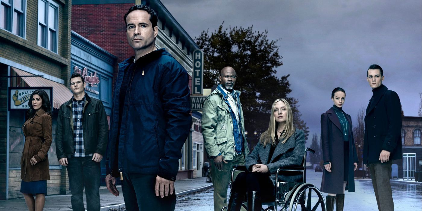 Il cast principale di Wayward Pines contro lo sfondo cupo della cittadina