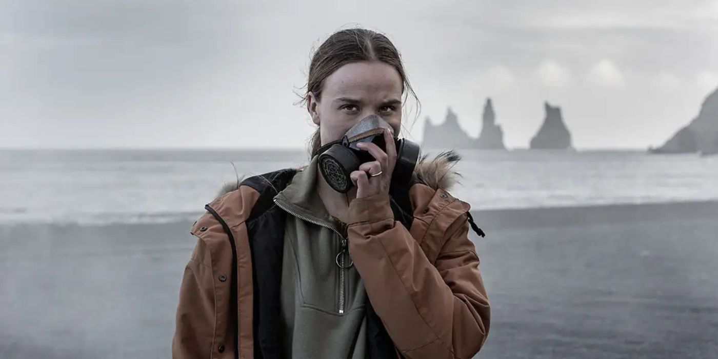 Gríma on the Katla television show, putting a gas mask in an Icelandic backdrop