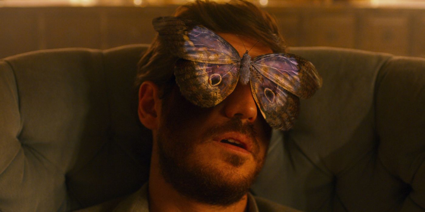 A close -up of a character in an invisible city with a large butterfly with eye marks covering part of his face