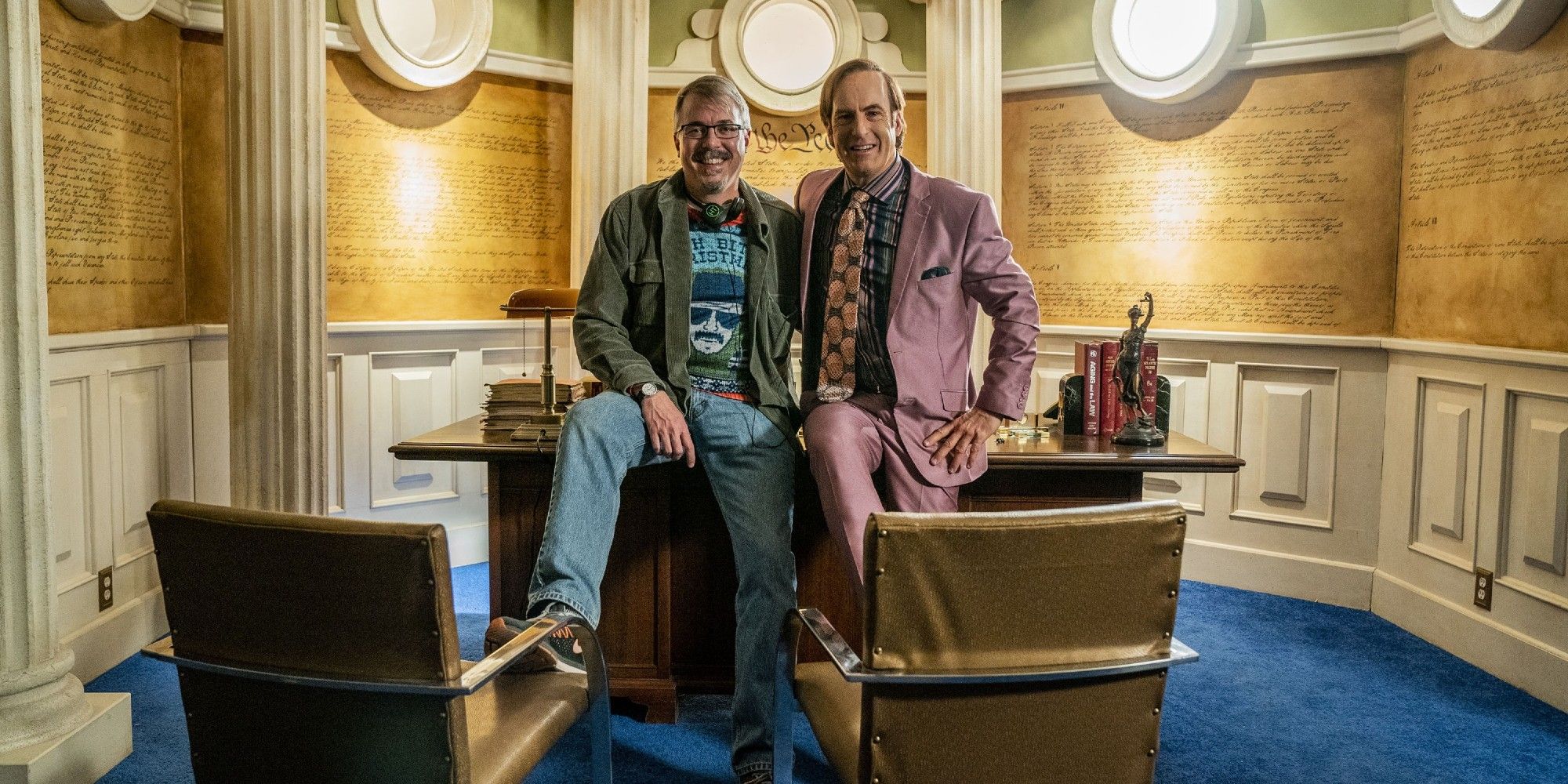 Vince Gilligan and Bob Odenkirk pose in Saul Goodman's office on the set of Breaking Bad