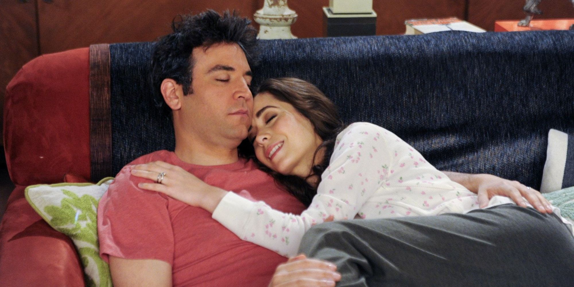 Tracy and Ted curled up on the sofa, falling asleep, in the way I met your mother.