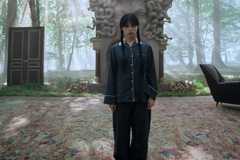 Wednesday standing in an outside space while wearing pajamas in Wednesday season 2, part 2