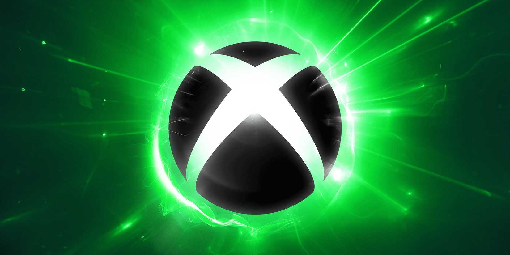 A black Xbox logo has green lights behind it.