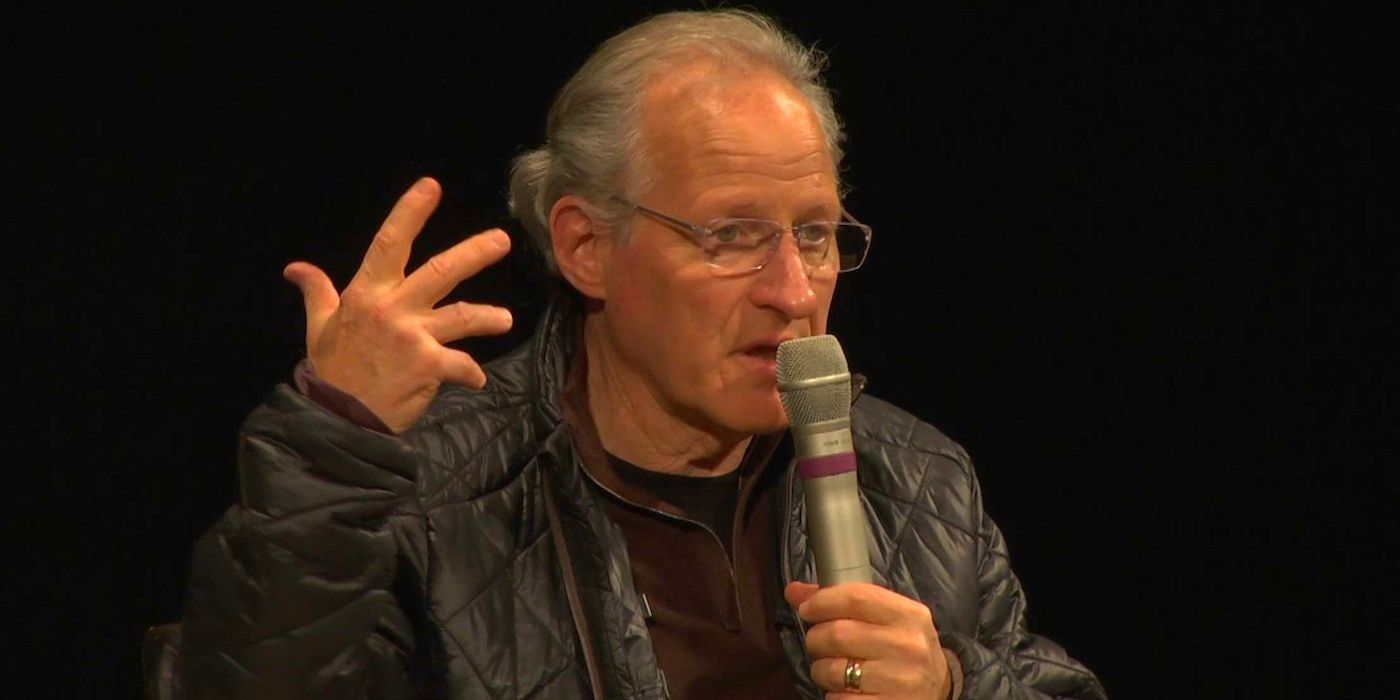 Michael Mann speaks in front of an audience 