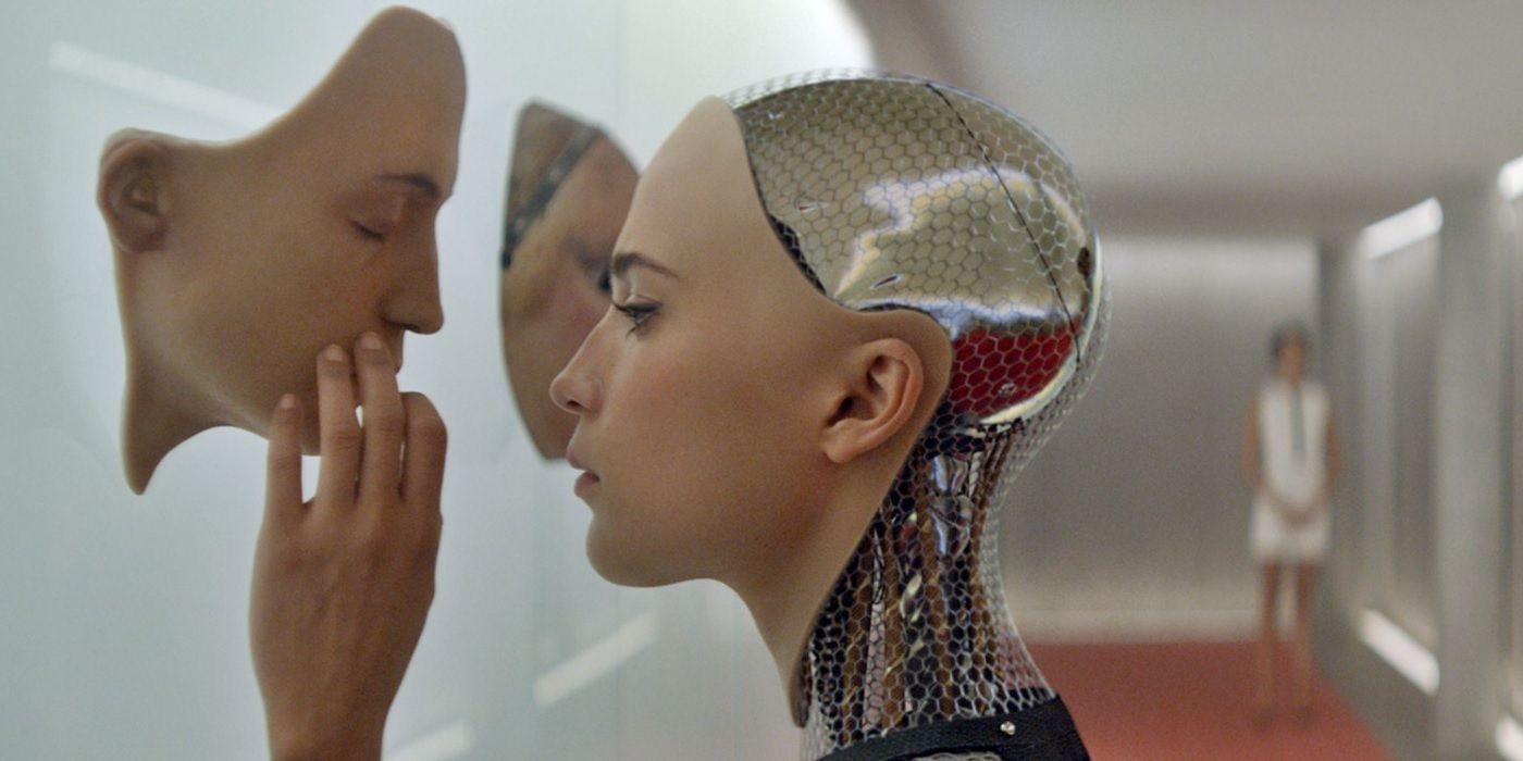 Alicia Vikander as a robot touching another robot's face in Ex Machina.