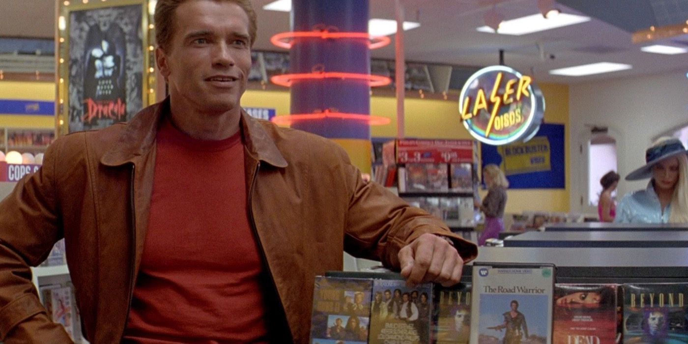 Arnold stands in a video store in Last Action Hero