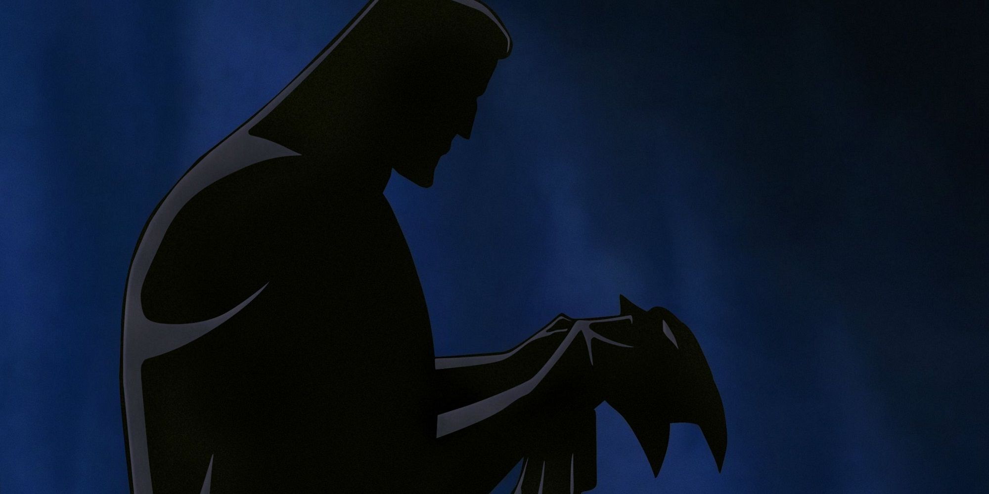 The silhouette of Bruce Wayne as he dons the Batman mantle for the first time.