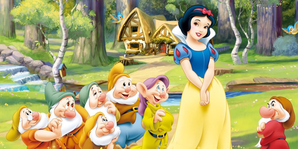 Snow White with the seven dwarves around her