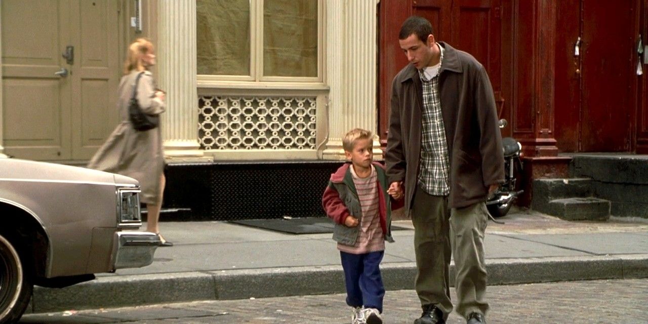 Adam sandler in big daddy walking across the street with a child