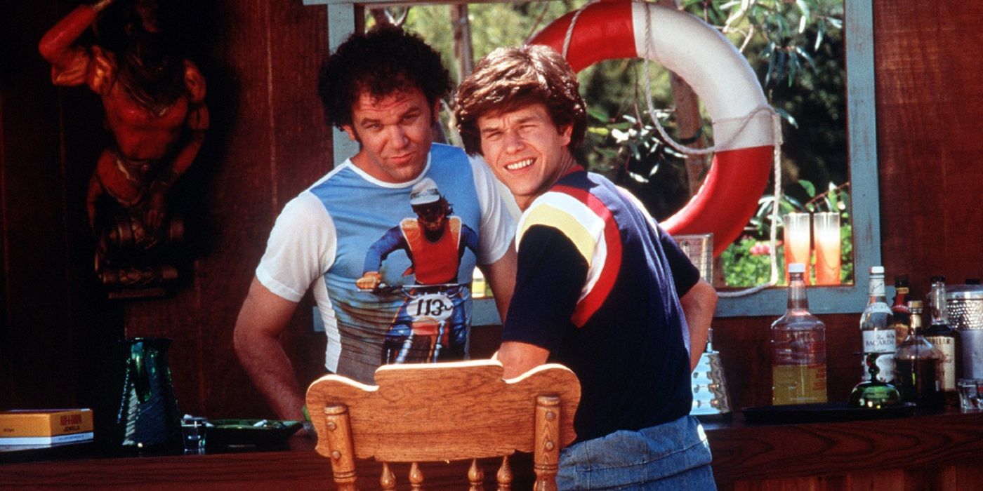 Mark Wahlberg and John C Riley smiling in Boogie Nights 