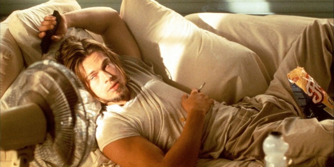 Brad Pitt lying on a couch in True Romance