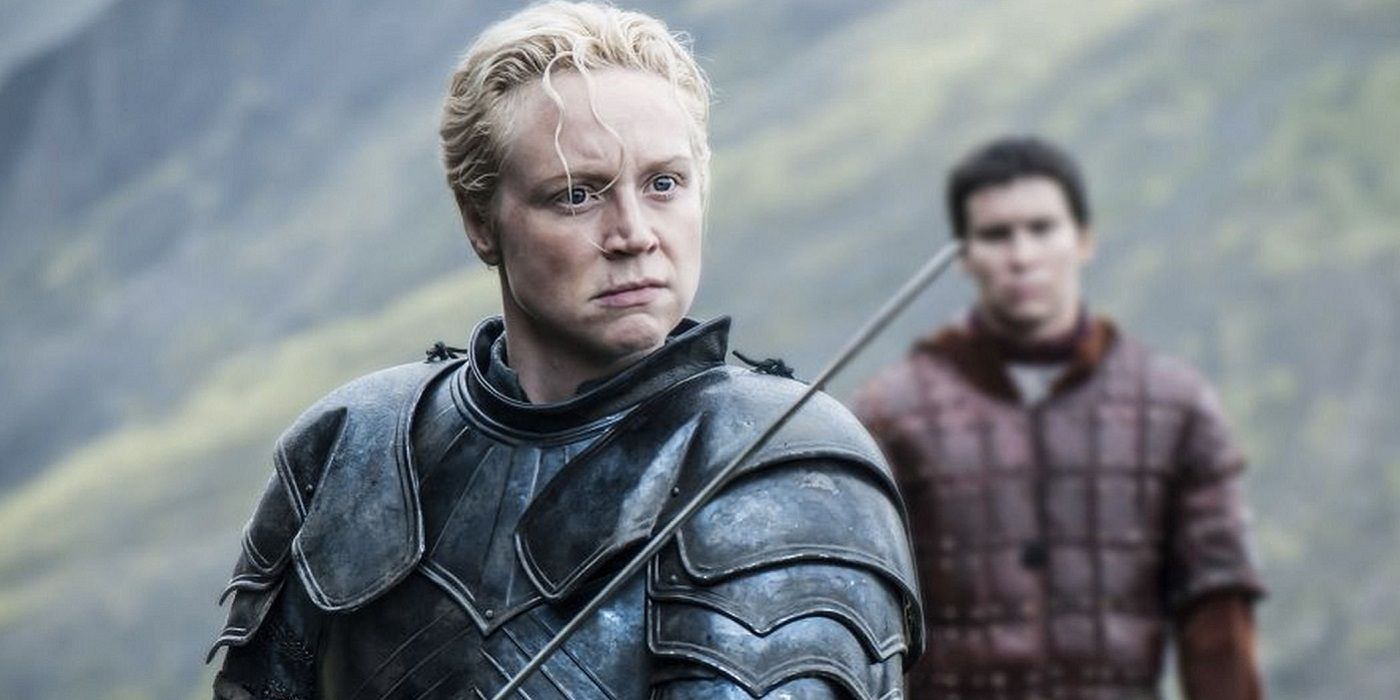 Brienne of Tarth wielding her sword in Game of Thrones as Podrick watches