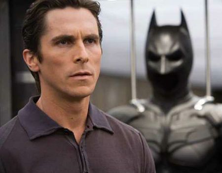 Christian Bale in Front of the Batman Suit