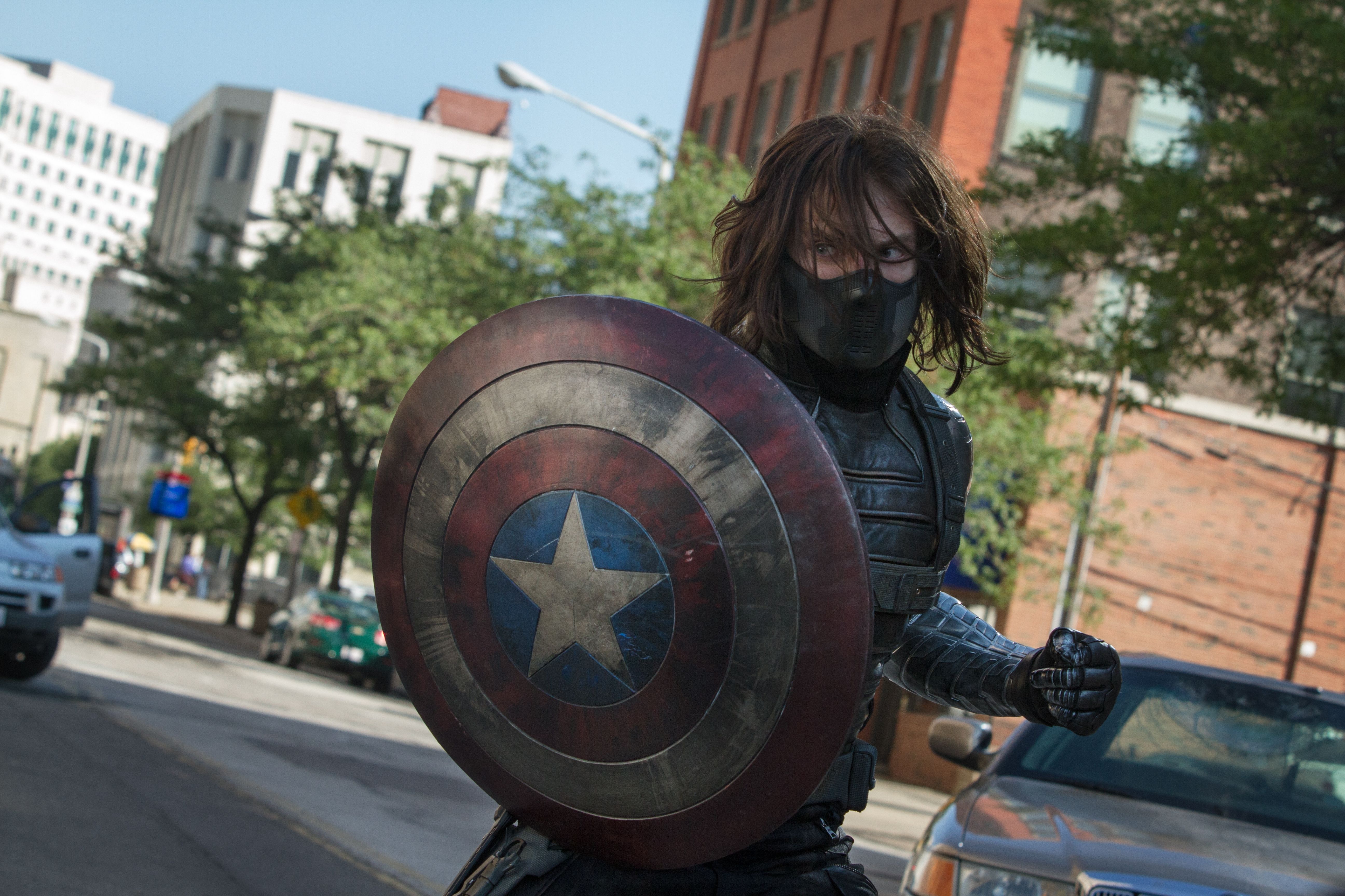 Bucky wields Cap's shield in Captain America: The Winter Soldier