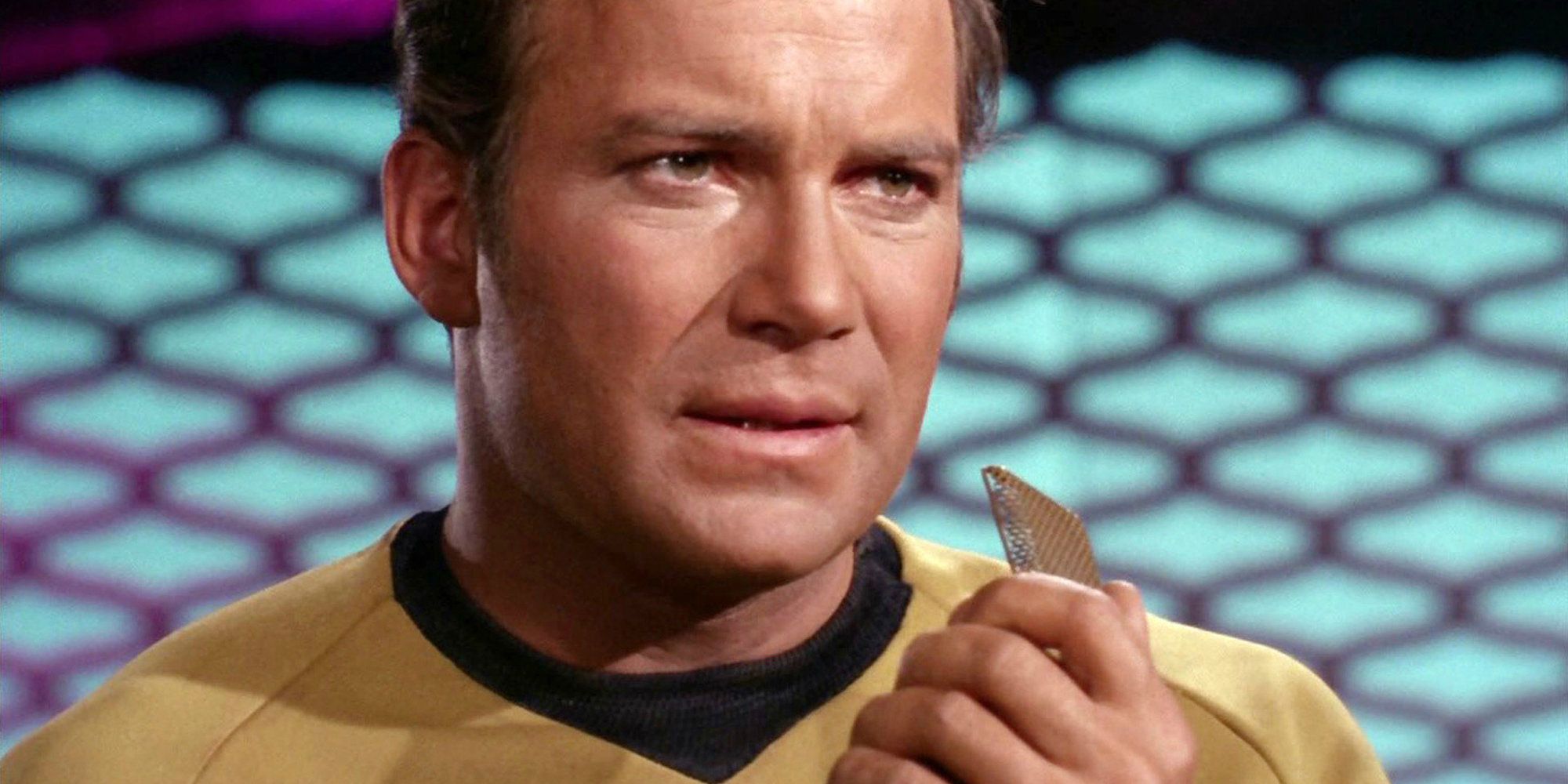 Kirk holds a communicator in Star Trek