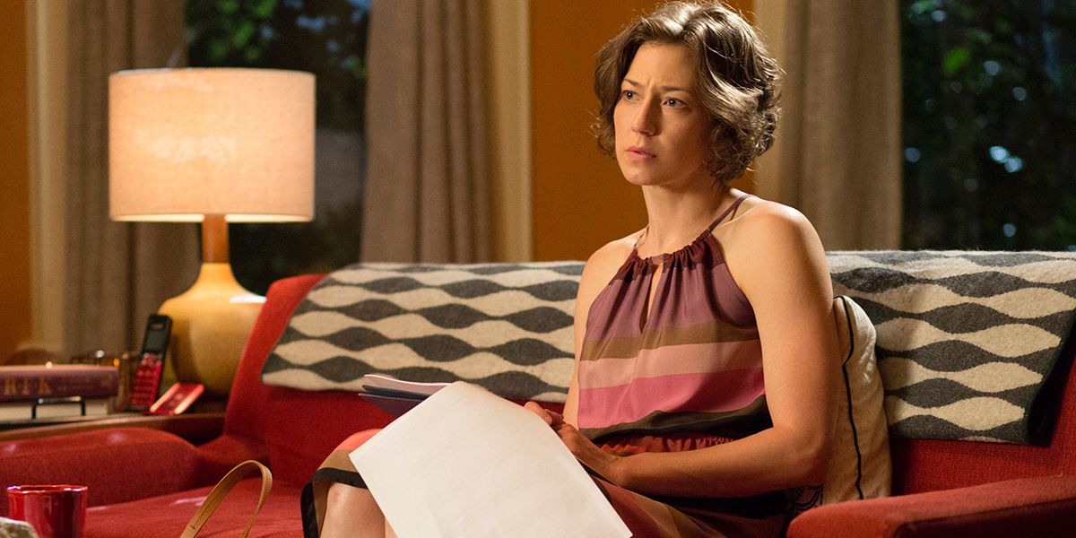 Nora Durst sitting on her couch looking sad in The Leftovers