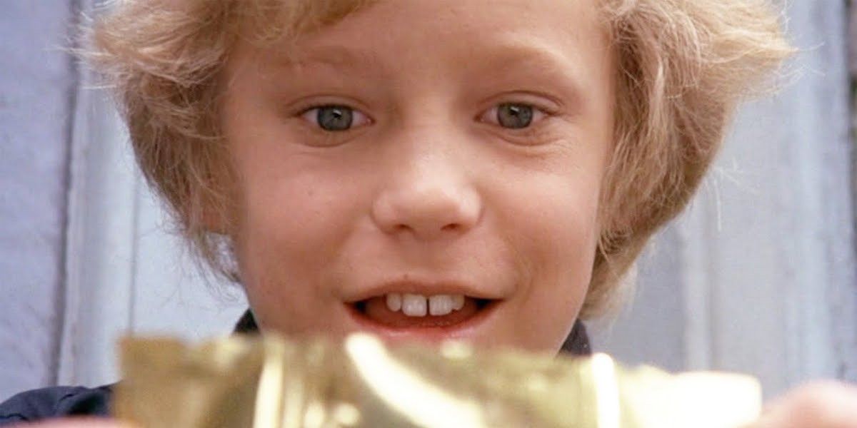 Charlie looking at his Golden Ticket in Willy Wonka and the Chocolate Factory