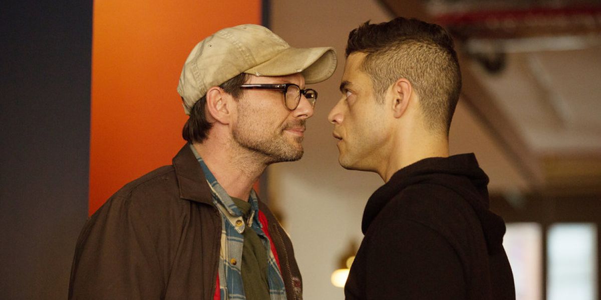 Christian Slater and Rami Malek face to face in a showdown in a scene from Mr. Robot.