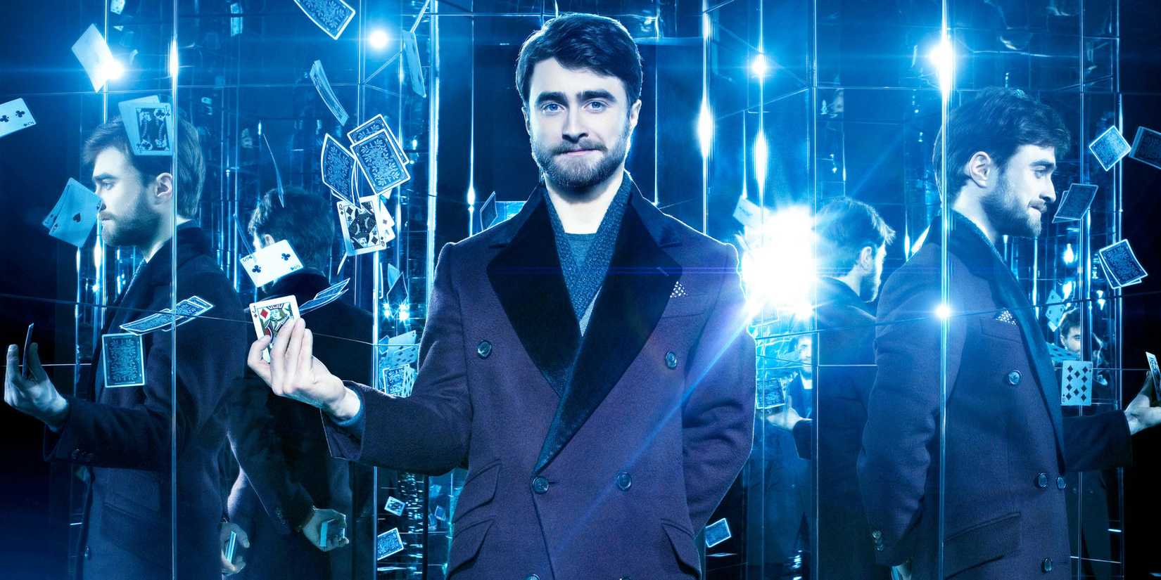 Daniel Radcliffe posing with playing cards in Now You See Me 2 promo