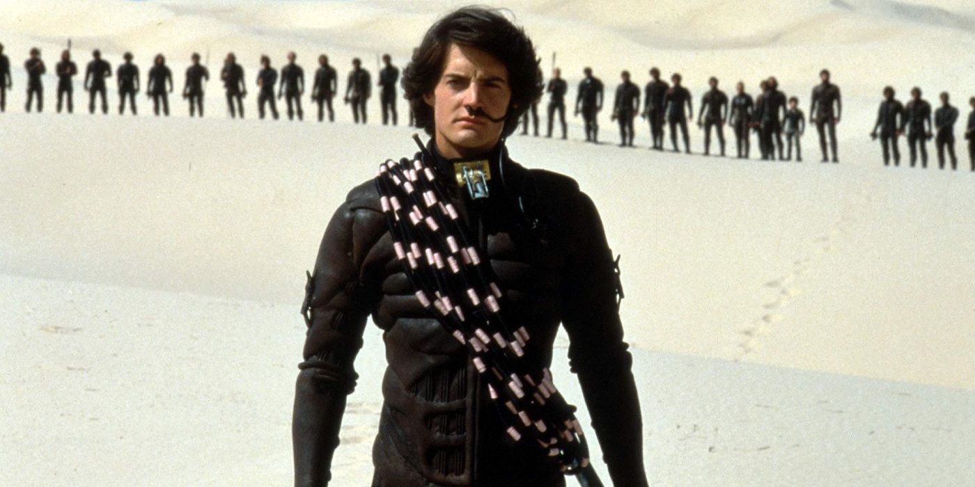 Paul stands before the Fremen tribe in the desert in Dune