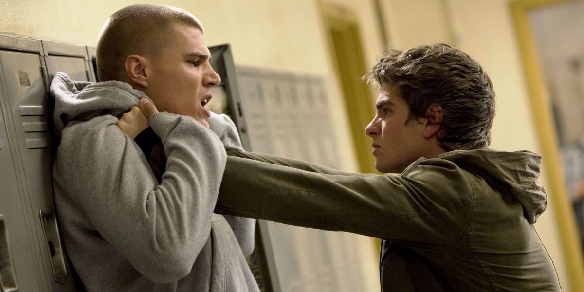 Flash Thompson against a locker by Peter Parker in Amazing Spider Man