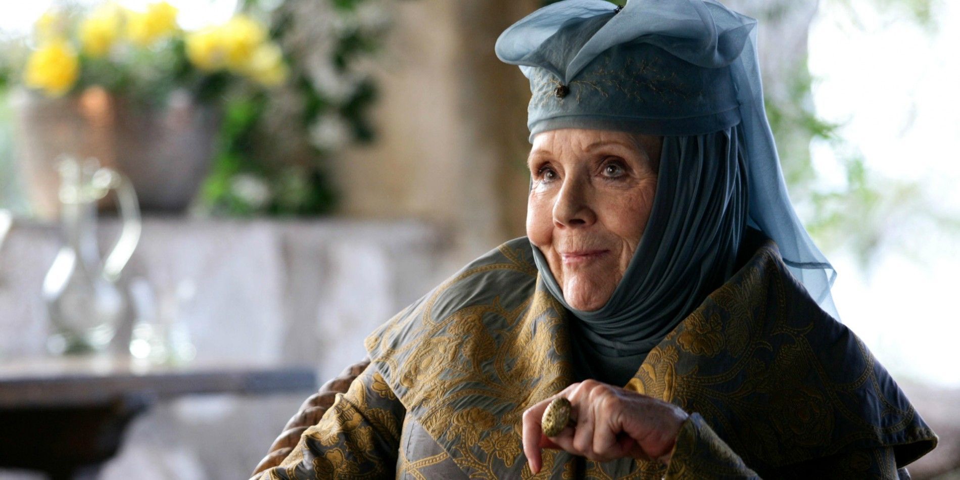 Olenna Tyrell sorrindo em Game of Thrones.