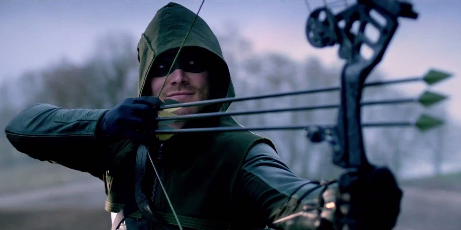 Green Arrow shooting three arrows at once
