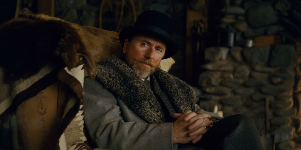 Tim Roth in an armchair in The Hateful Eight