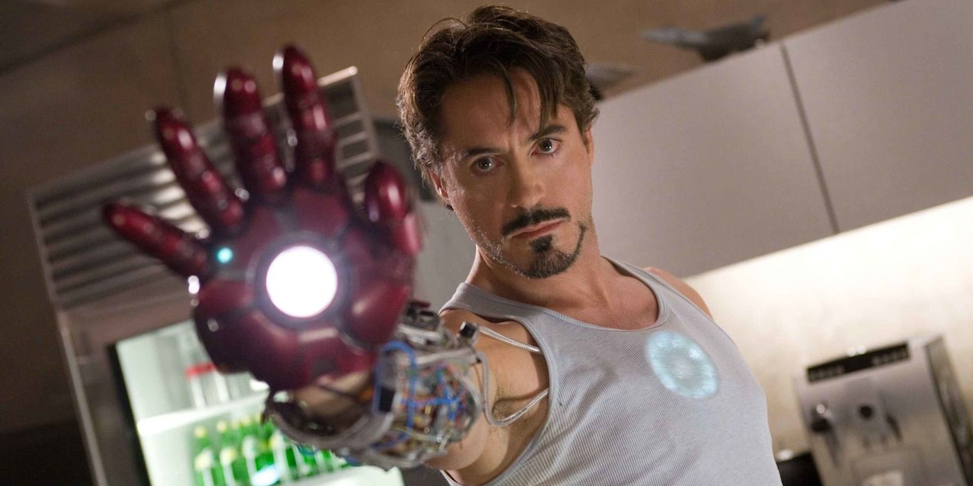 Tony Stark raising a prototype gauntlet in Iron Man 2008