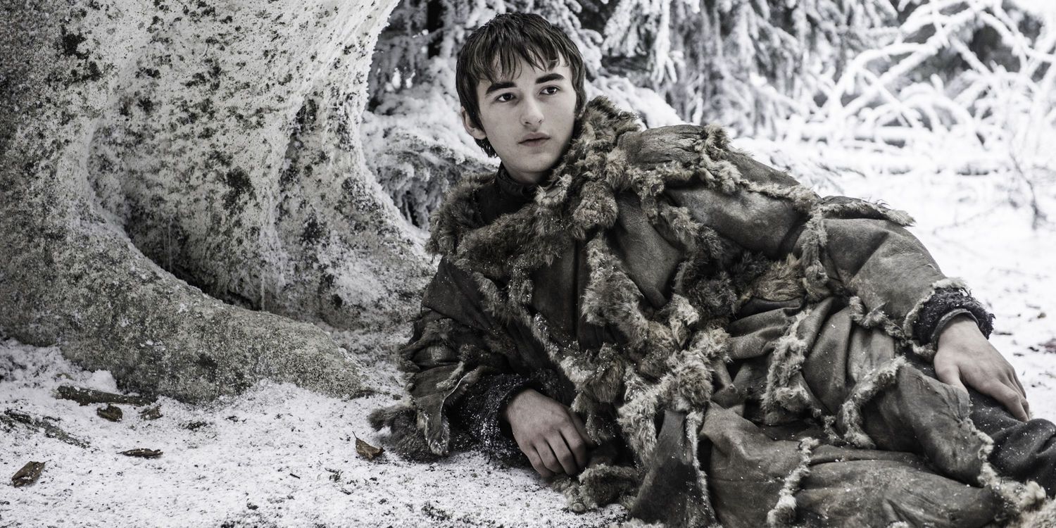 An image of Bran Stark lying in the snow in Game of Thrones
