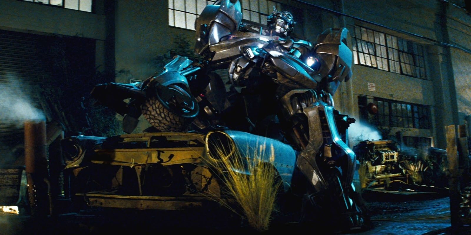 Jazz in transformers sitting on a car
