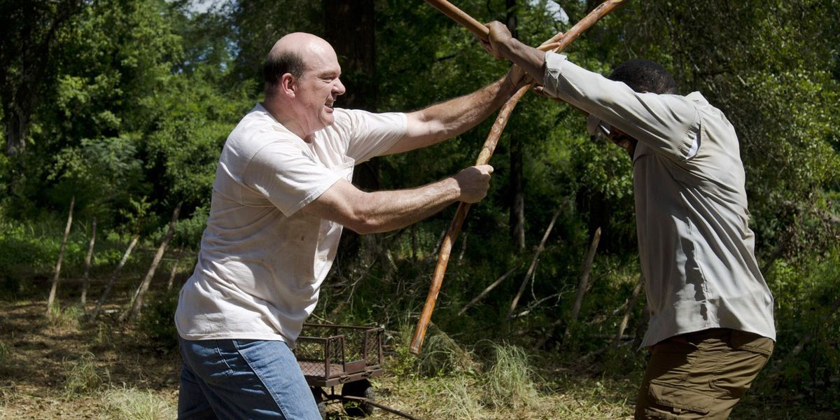 Eastman fighting with another man in TWD