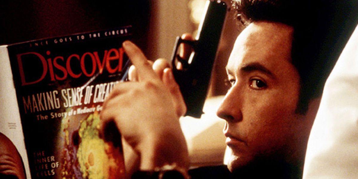 John Cusack relaxes with a gun in his hand from Grosse Pointe Blank 