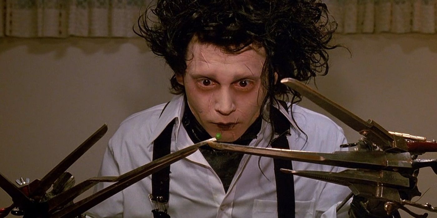 Edward Scissorhands attempting to eat a single pea at the family dinner table with his scissor hands in Edward Scissorhands 