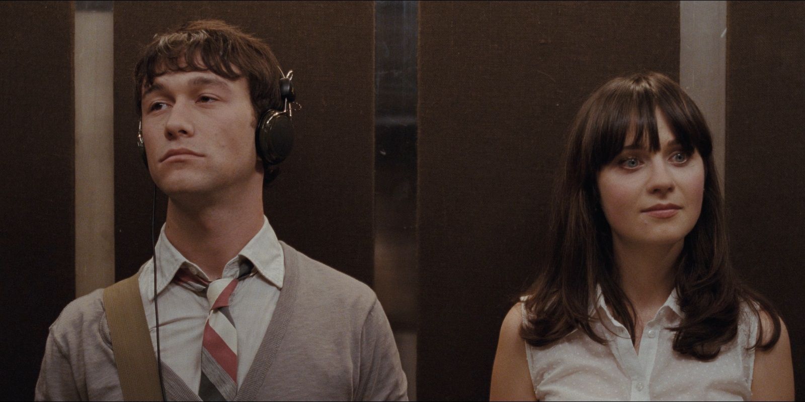 Tom (Joseph Gordon Levitt) and Summer (Zooey Deschanel) inside an elevator in 500 Days of Summer. 