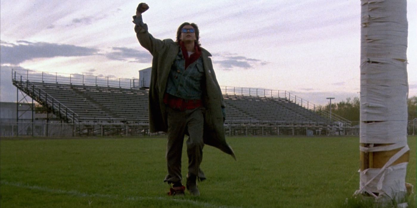 Judd Nelson pumping his fist on the football field in The Breakfast Club