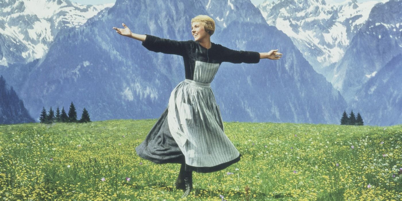 Julie Andrews spinning in the grass in Sound of Music