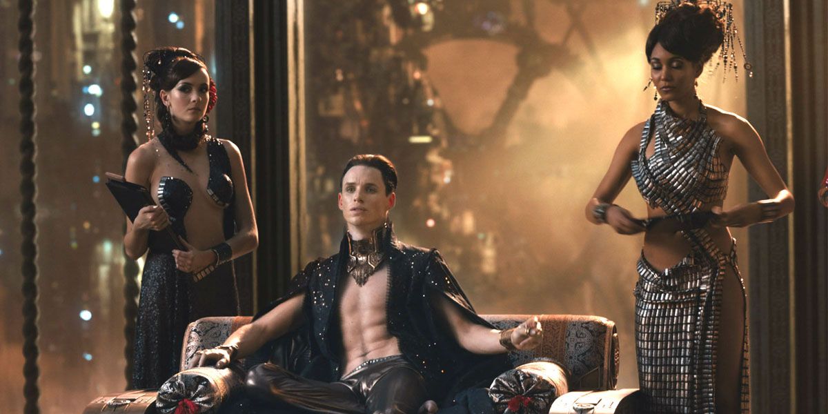 Eddie Redmayne lounges on a couch from Jupiter Ascending