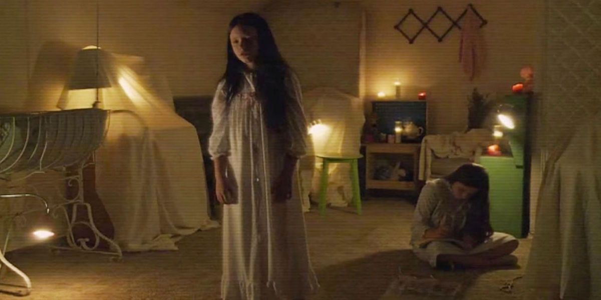 Chloe Csengery as Katie and Tyler Brown as Kristi in Paranormal Activity: The Ghost Dimension